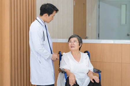 Doctor in professional uniform examining patient at medical clinic or hospital.の写真素材