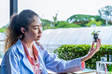 Female scientist experimenting with organic plant cultivation.