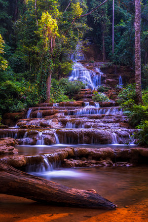 Low angle view of Pha Charoen Waterfall. Namtok Pha Charoen National Park at Amphoe Phop Phra and Amphoe Mae Sot, Thailand.の写真素材