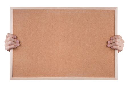 Cork notice board in hands isolated on whiteの写真素材