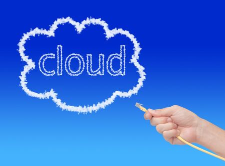 hand connecting cable to the cloudの写真素材