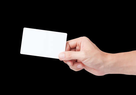 hand holding white card isolated on blackの写真素材