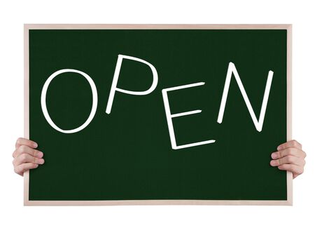 open on blackboard with handsの写真素材