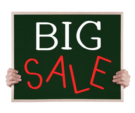big sale on blackboard with handsの写真素材