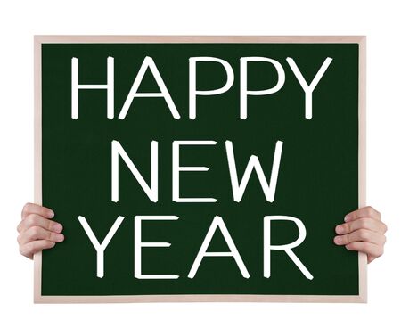 happy new year on blackboard with handsの写真素材