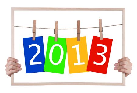 new year 2013 on whiteboard with handsの写真素材