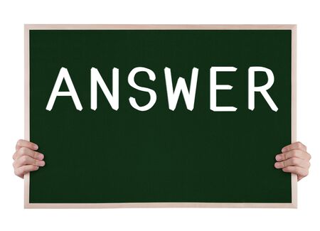 answer on blackboard with handsの写真素材