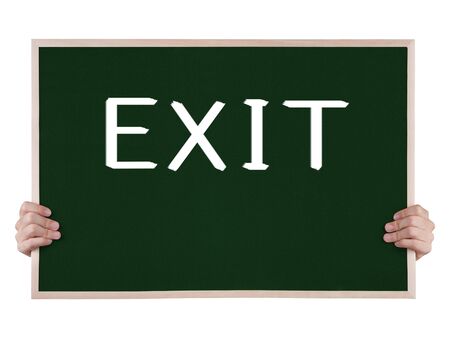 exit on blackboard with handsの写真素材