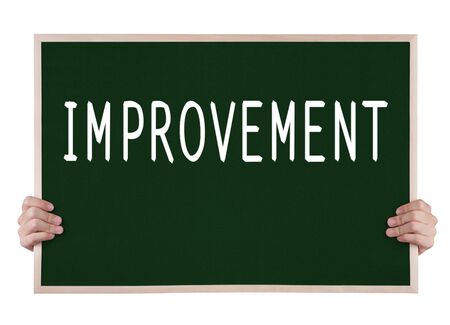 improvement on blackboard with handsの写真素材