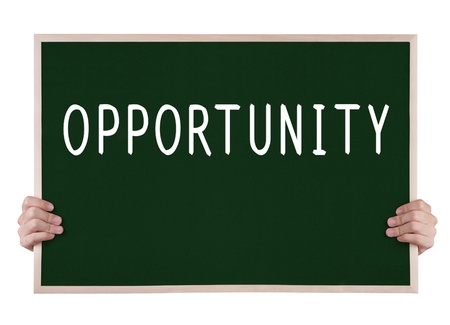 opportunity on blackboard with handsの写真素材