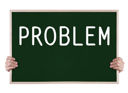 problem on blackboard with handsの写真素材
