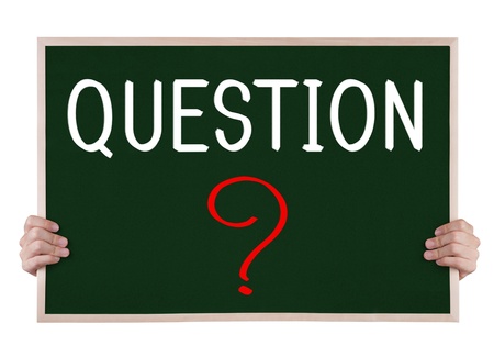 question on blackboard with handsの写真素材