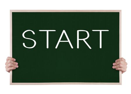 start on blackboard with handsの写真素材