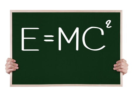 e=mcÂ² on blackboard with handsの写真素材