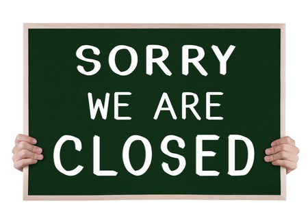 sorry we are closed on blackboard with handsの写真素材