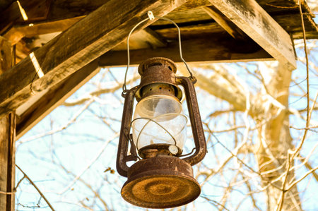Railroad oil lamp on barnの写真素材