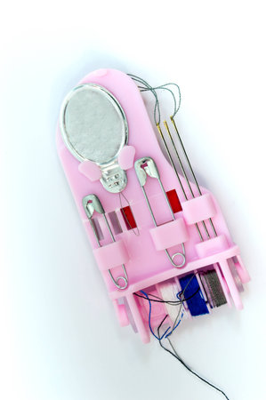Portable device for the repair of clothing on white background.