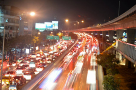 Blurred images of traffic jams in Bangkok at night.