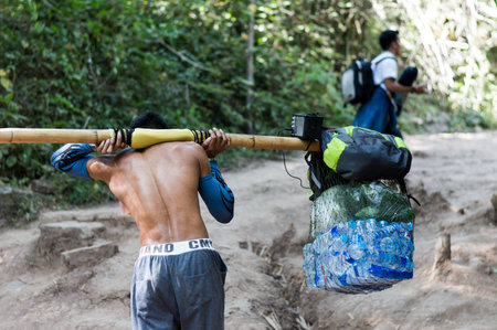 Loei / Thailand - Dec 2016:Strongest Man hired baggage of an on Phu Kradueng, Loei,Thailand on Dec 26, 2016 in Loei Thailand.の写真素材