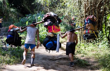 Loei / Thailand - Dec 2016:Strongest Man hired baggage of an on Phu Kradueng, Loei,Thailand on Dec 26, 2016 in Loei Thailand.のeditorial素材