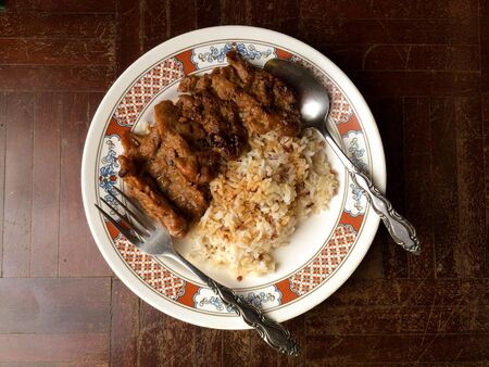 rice with grill pork and cooked with soy bean source ready to serveの写真素材