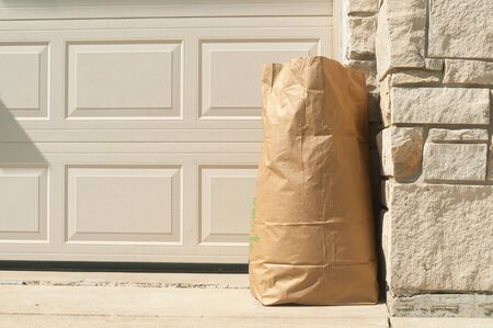 environmental trash bag in front home for concerning about global warmingの写真素材