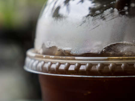 Close up shot of iced coffee in plastic cupの写真素材