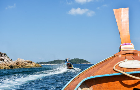 Tourist boats heading off to snorkeling diving area. Skin diving boat trip around Lipe island, southern Thailand.の写真素材