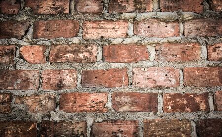 Vintage weathered red brick wall texture background.の写真素材