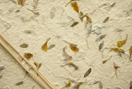 Natural paper texture background. Handmade paper using natural organic fiber, traditional technique.の写真素材