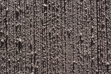 Dark brown scratched texture of cement wall for background.