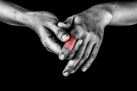 women has inflammation and swelling cause a pain the Injured painful finger, isolated on white background.の写真素材
