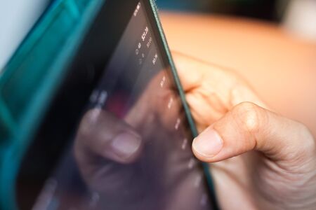 Woman holding digital tablet device in hands.の写真素材