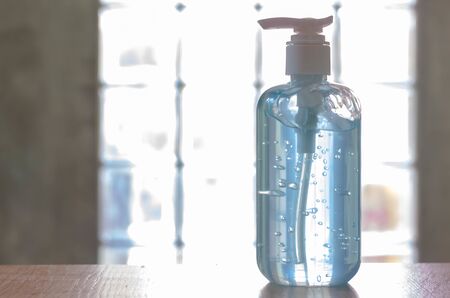 Washing hands with alcohol gel. Sanitizer after using a public restroom. Hygiene concept. Prevent the spread of germs and hand hygiene corona virus protection.の写真素材