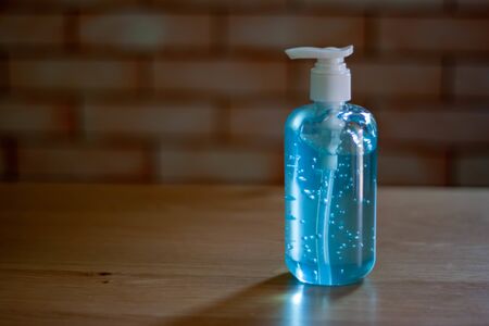Washing hands with alcohol gel. Sanitizer after using a public restroom. Hygiene concept. Prevent...