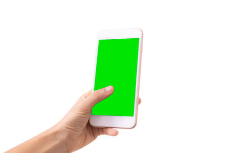 Close-up woman of Left hand held use finger touches with digital smartphone green screen isolated on white background. Concept of technology, connection, communication, social.の写真素材