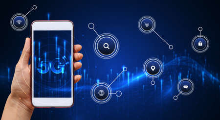 Hand of woman or man holding smartphone use 5G network wireless systems and internet of things with...
