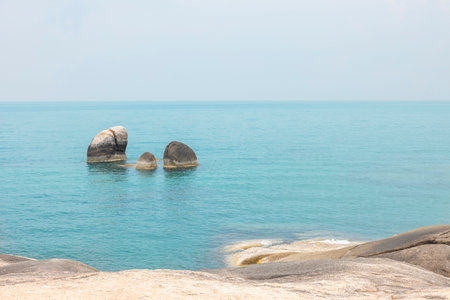 Sea landscape with rocks in the foreground and sky in the background. Therapeutic natural scenery gives a feeling of relaxation. At Koh Samui, Surat Thani Province, Thailand.の写真素材