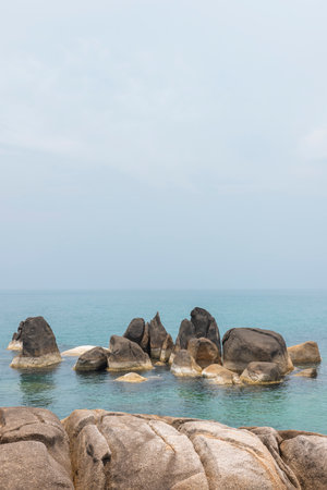 Sea landscape with rocks in the foreground and sky in the background. Therapeutic natural scenery gives a feeling of relaxation. At Koh Samui, Surat Thani Province, Thailand.の写真素材