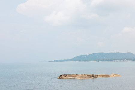 Sea landscape with rocks in the foreground and sky in the background. Therapeutic natural scenery gives a feeling of relaxation. At Koh Samui, Surat Thani Province, Thailand.の写真素材