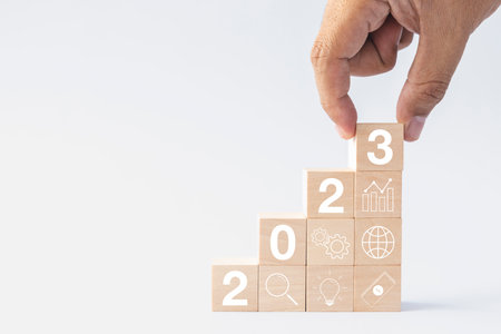 2023 business growing growth concept to success. hand picking woods block step with icon concept...