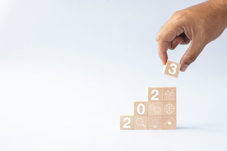 2023 business growing growth concept to success. hand picking woods block step with icon concept about business strategy, Action plan, Goal and target, hand stack, project, vision.の写真素材