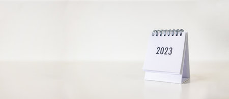 New year 2023 business calendar on office table in new year day. Make a work plan for the start of...