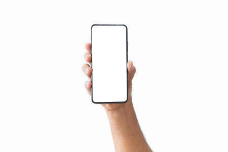 Male hand holding black smartphone with blank screen and modern frameless design two positions angled copy space isolated on white background. close-up hand of man hold mobile phone. Space for text.の写真素材
