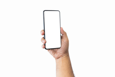 Male hand holding black smartphone with blank screen and modern frameless design two positions angled copy space isolated on white background. close-up hand of man hold mobile phone. Space for text.の写真素材