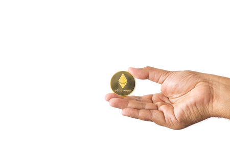 close-up hand of man holding crypto coin copy space isolated on white background. Blockchain technology finance in future. Male hand hold Ethereum. concept about business, finance, trade, economy.の写真素材