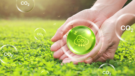 Hand holding with icons of reducing CO2 emissions, ESG, net zero. energy saving concept. save our planet, world environment day, world earth day. sustainable development and green business.の写真素材