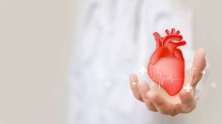 Hand hold heart shape on pink background for health care checking the function of the patient heart. health insurance, love, international cardiology day, check up, heart attack and cardiology.の写真素材