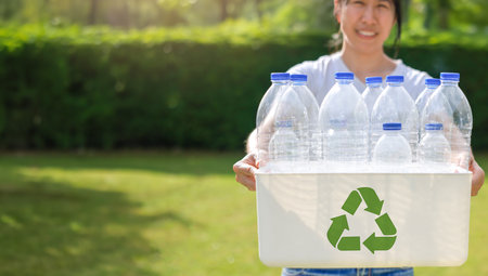 Plastic bottle for separating recycle materials from the garbages. Recycling in environmental sustainability and reducing carbon emissions, protect the environment, reducing waste, recycling materialsの写真素材