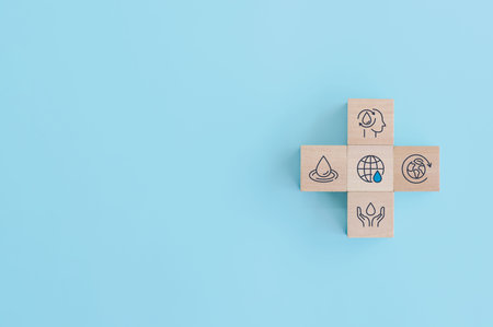 Wooden block with icons for World Water Day. accelerating change and every drop matters. Saving...